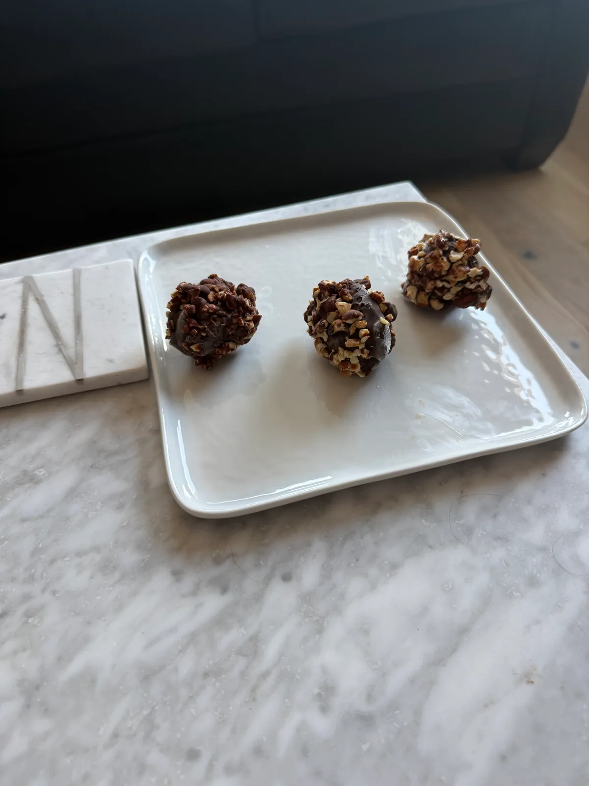 3 ice cream bon bons with chocolate hazelnut coating